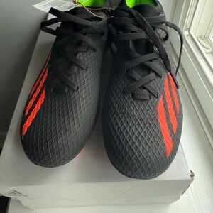 Adidas Black and Orange Soccer Cleats